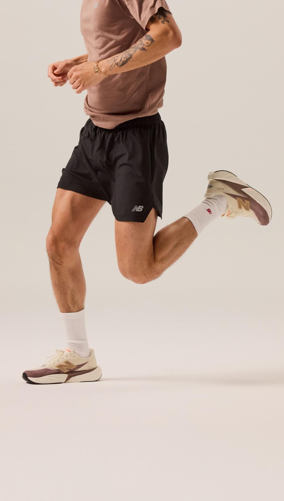 Endrick volley kicking a tennis ball while wearing New Balance T500 shoes. 